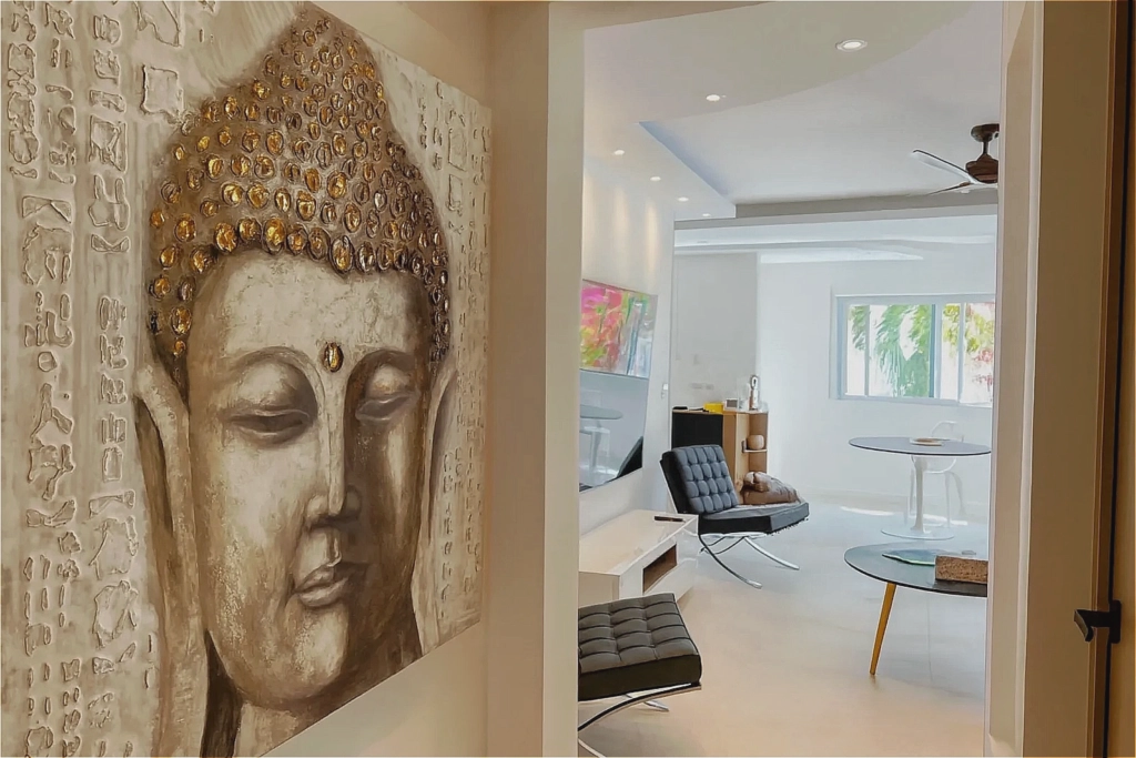 Decorative Buddha sculpture overlooking a bright modern apartment in Playa del Carmen