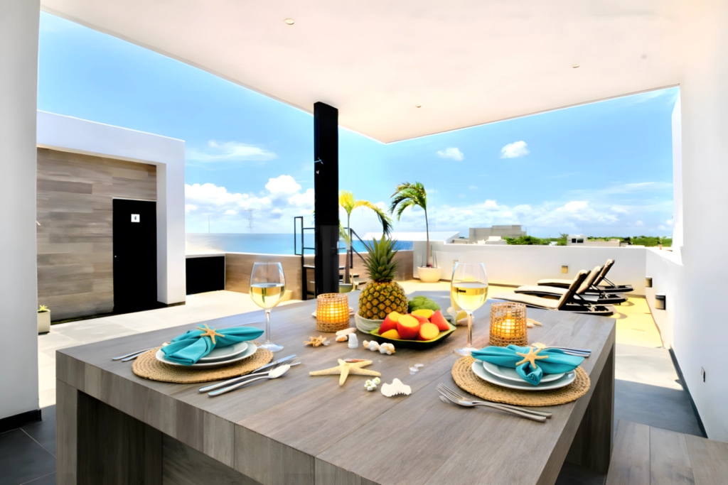 Terrace & Outdoor Dining – Vedra Suite Playa del Carmen Terrace with outdoor dining area, sun loungers and tropical atmosphere at Vedra Suite in Playa del Carmen